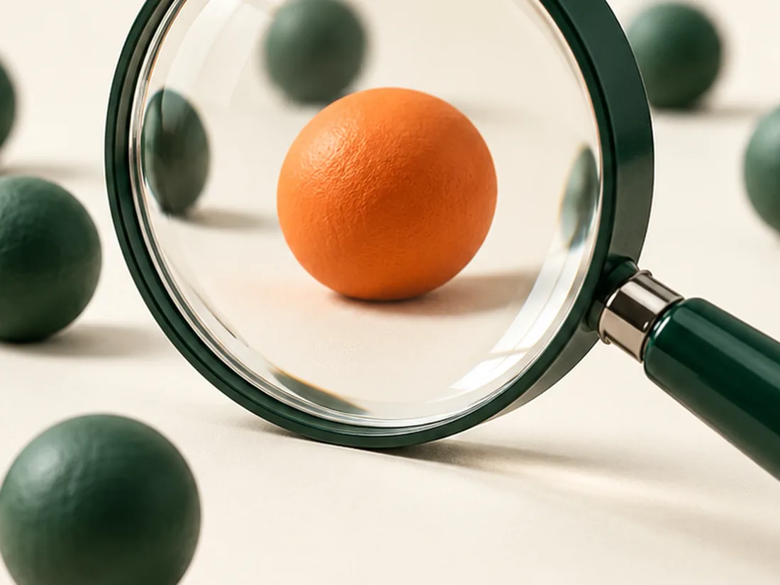 Be found when it matters. A magnifying glass picking out a single orange sphere among green ones.